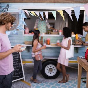 customers-having-snacks-from-food-truck-EDLBVPX.jpg